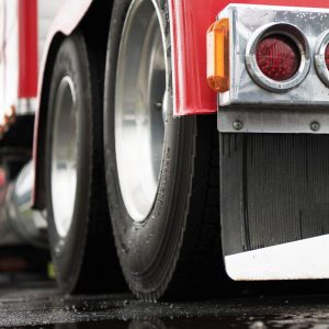 Powerful Semi Truck Tractor Rear View. Heavy Duty Transportation Industry Concept.